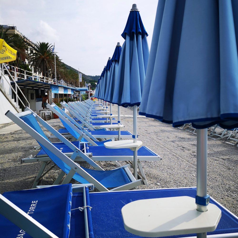 deck chairs and umbrellas on the sandy beaches of the Ligurian Riviera of Spotorno